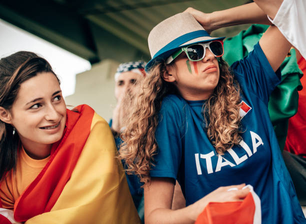 istock italian and spanish supporter at the stadium 1326995926