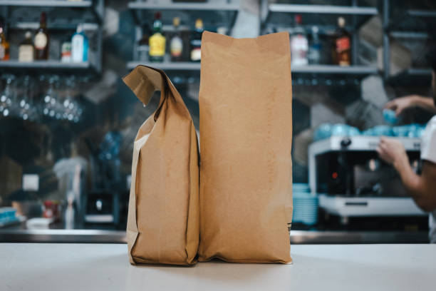 istock take away cup and bean bags in modern coffee shop 1326998254