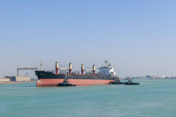 istock Vessel approaching to berth with tugs assistance. Mooring operations. Bulker. Dry cargo ship. 1326998380