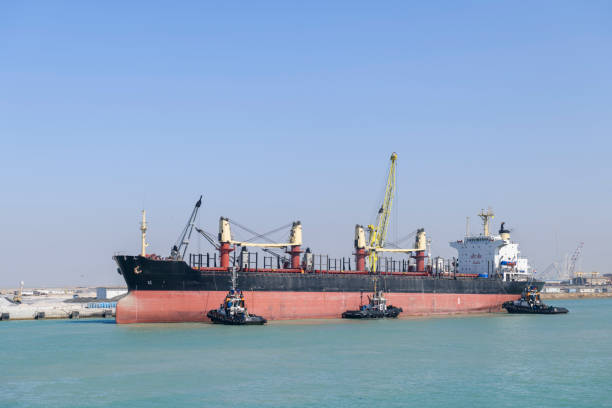 istock Vessel approaching to berth with tugs assistance. Mooring operations. Bulker. Dry cargo ship. 1326998386