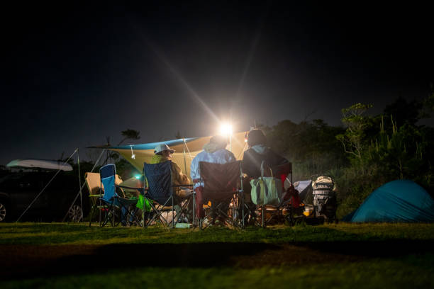 istock Japanese families camping at night, enjoying dinner 1327001010