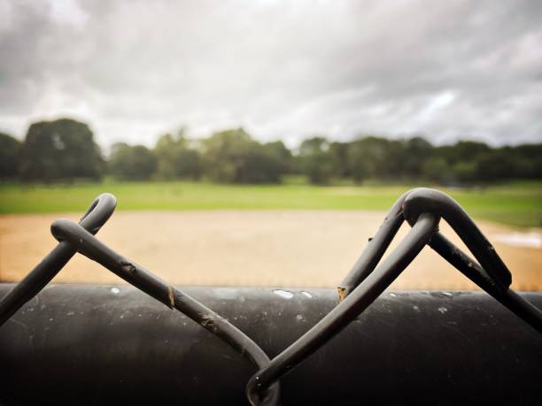 istock ChainLink Fence at an Overcast Ball field 1327001619