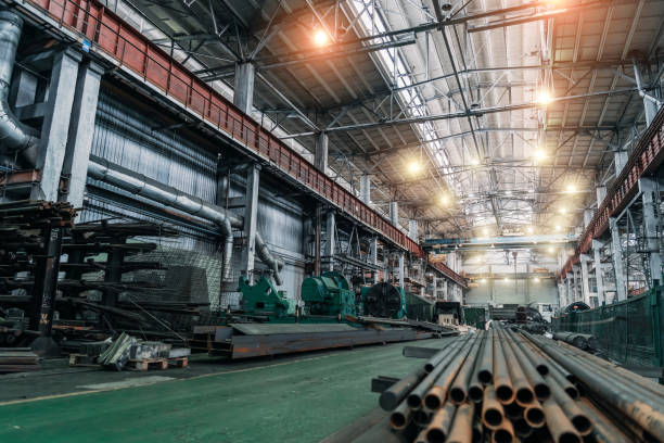 istock Workshop factory interior with machines, industrial lathes and steel pipes for processing metal production 1327002497