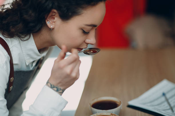 istock Cup Taster Girl Tasting Degustation Coffee Quality Test. Coffee Cupping 1327007623
