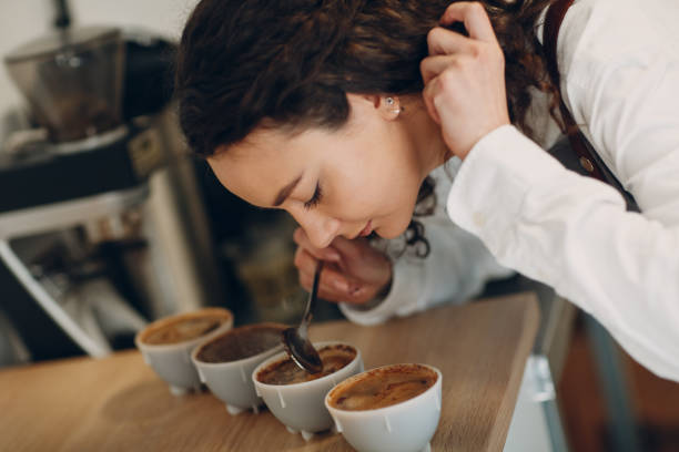 istock Cup Taster Girl Tasting Degustation Coffee Quality Test. Coffee Cupping 1327007624