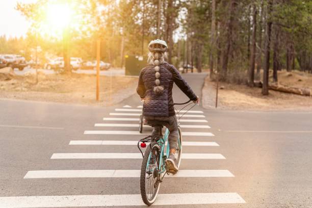 istock Environmentally conscious senior woman commuting by bike 1327007768