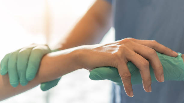 istock Surgeon, surgical doctor holding patient hand in professional ER emergency operation room for health care trust, medical anesthetic safety by anesthetist or anesthesiologist healthcare support concept 1327007792