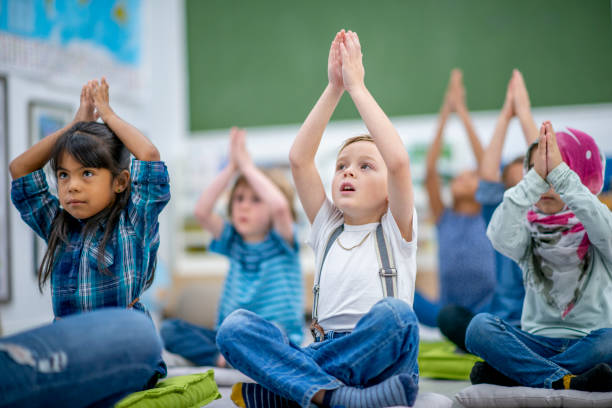 istock Kids doing yoga in class 1327008016