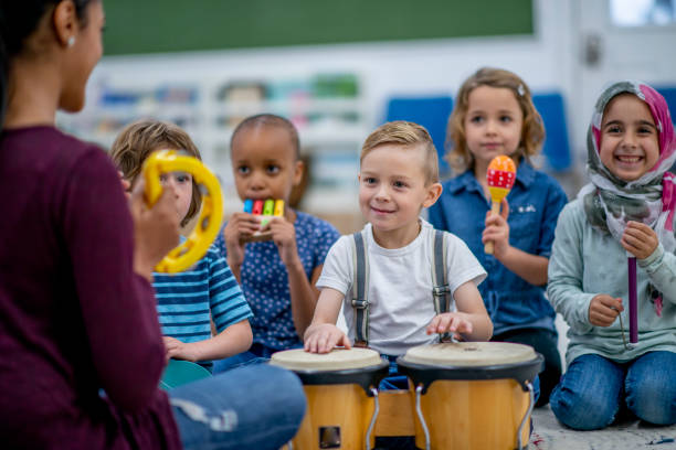 istock Kids playing music in preschool 1327008026
