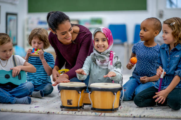 istock Kids playing music in preschool 1327008035