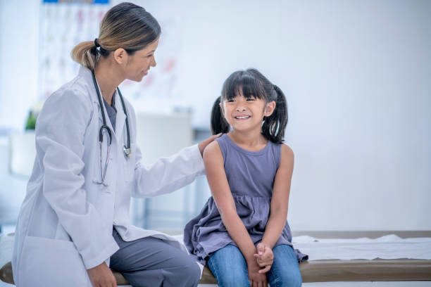 istock Happy child at doctor's appointment 1327008210