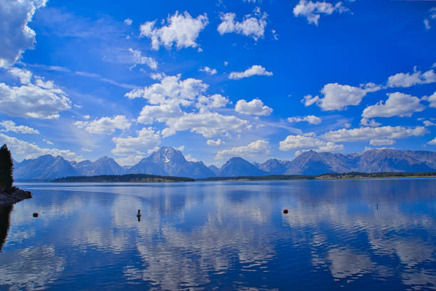 Jackson Lake, crystal lakes, showing reflection and majestic mountains. Grand Teton National Park is located in northwestern Wyoming, USA. 2017.
