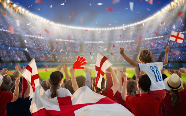 England football team supporter on stadium. England football supporter on stadium. English fans on soccer pitch watching team play. Group of British supporters with flag and national jersey cheering for UK. Championship game. Go Britain! jersey england stock pictures, royalty-free photos & images