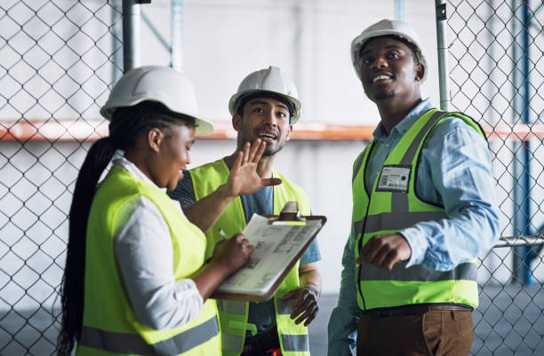 istock Shot of a group of builders inspecting a construction site 1327011890