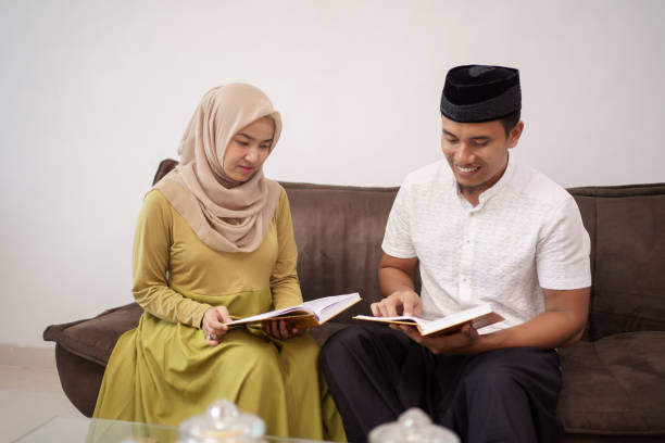 istock muslim couple reading holy quran 1327015483