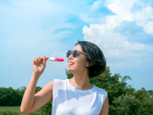 istock Woman with pink popsicle. 1327016223