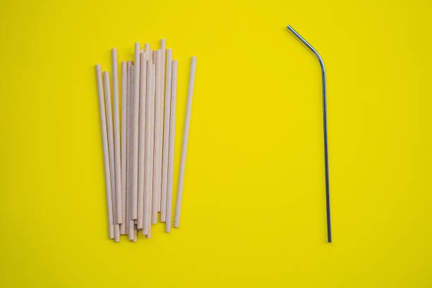 istock Steel drinking vs disposable straws on a yellow background. Zero waste concept 1327017668