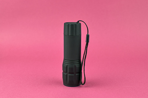 Black pocket flashlight. Small flashlight
