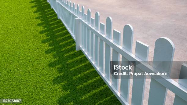 White Wooden Picket With Green Artificial Turf In Front Yard Area Stock Photo - Download Image Now