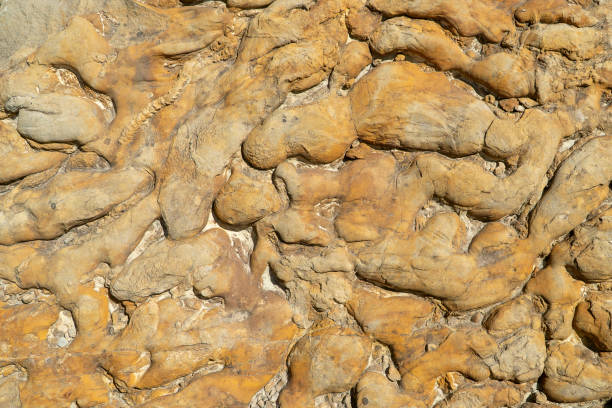 istock Macro of uneven convex copper colored rock surface 1327025663
