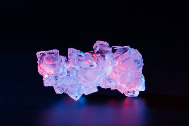 istock colorful Quartz Rainbow crystal stone closeup isolated on black background 1327026422