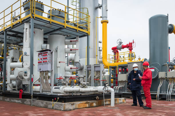 istock Engineers and staff communicate on site in chemical plant 1327028611