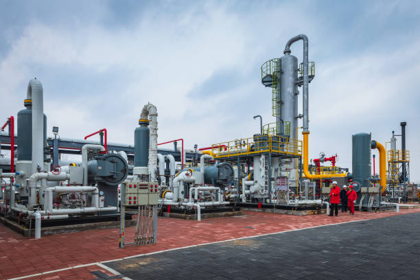 Engineers and staff communicate on site in chemical plant