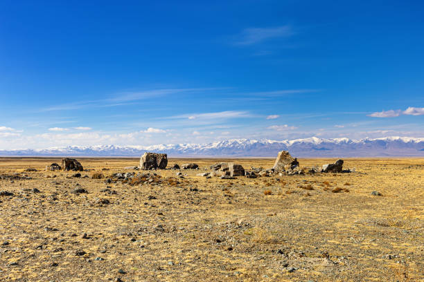 istock Tarkhatinsky megalithic complex consists of stone blocks. Archaeological monument in Chui steppe, Altai Republic, Russia 1327028708