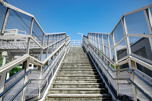 Empty stairs to an elevated pedestrian walkway
