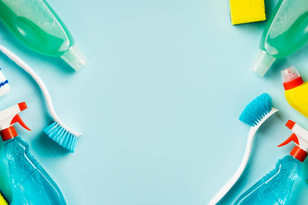 istock Frame from set various cleaning supplies on blue background with copy space, top view 1327032296
