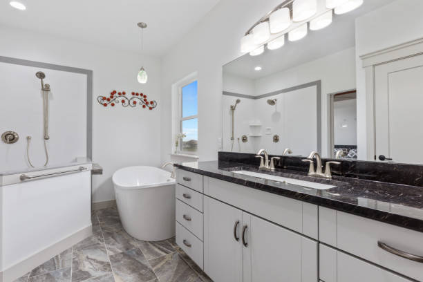 istock Black and white bathroom with walk-in shower 1327036763