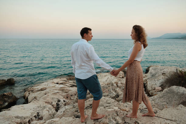 istock Couple on an evening seaside date 1327039559