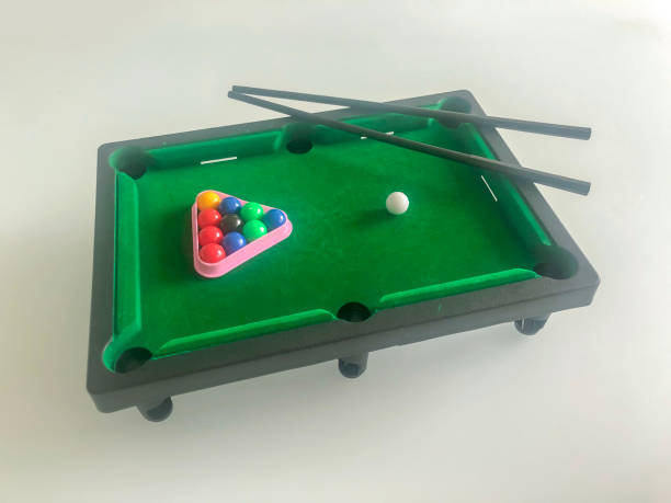 istock Mini billiard table with cue and balls 1327040342