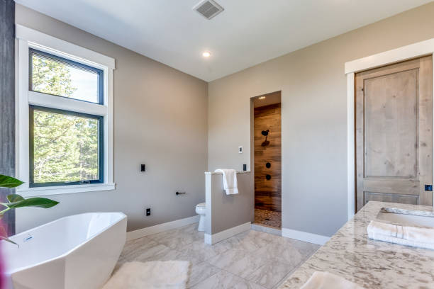 istock New bathroom with white acrylic free standing bathtub 1327040693