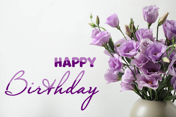 istock Happy Birthday! Eustoma flowers in vase on white background 1327041766