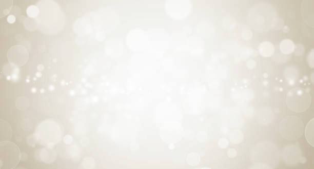 istock White Glitter Vintage Lights on Yellow Texture Background. Bokeh Silver and White. Defocused, Celebration, Christmas Holiday Background. 1327041875