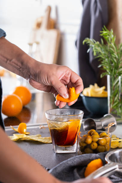 istock Mixologist making refreshing cocktail with vermouth at home 1327041981