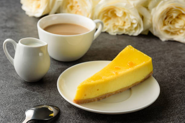 istock lemon cheesecake with coffee close-up. 1327043027