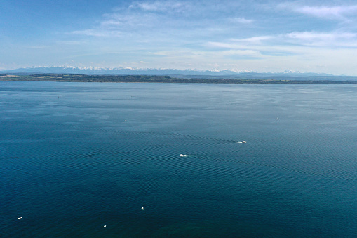 Lake Neuchâtel with a surface of 218.3 km2 (84 sq mi), Lake Neuchâtel is the largest lake located entirely in Switzerland. The high angle image was captured during springtime.