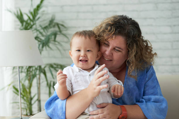 istock Loving Woman Hugging Son 1327048446