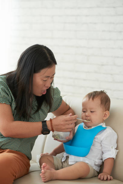 istock Baby Eating Lunch 1327048459