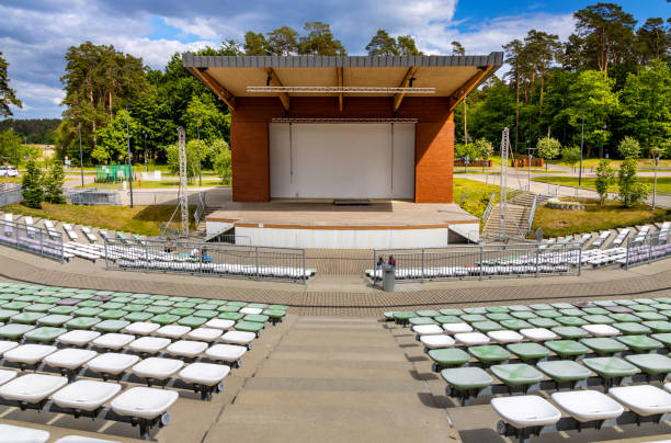 Amphitheater performance stage in Masuria lake district resort of Augustow in Poland Augustow, Poland - June 1, 2021: Open air amphitheater performance stage on shore of Necko lake in Masuria lake district resort town of Augustow in Podlaskie voivodship kanal stock pictures, royalty-free photos & images