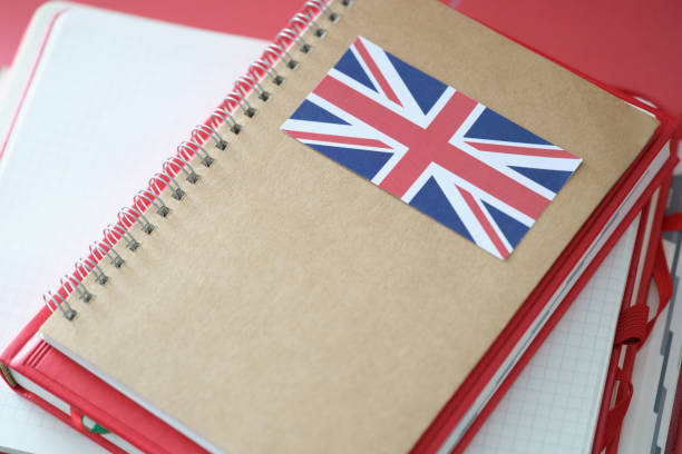 istock Stylish notepad with britain flag and copybooks on table 1327052282