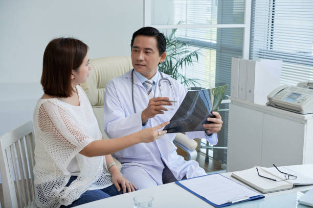 istock Physician Discussing Feet X-ray with Patient 1327052830