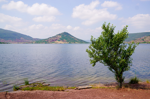 Lake Salagou french Lac wide panorama calm water and colorful hills in south france