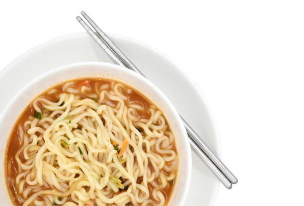 istock Korean spicy noodles with vegetables isolated on white background 1327056400