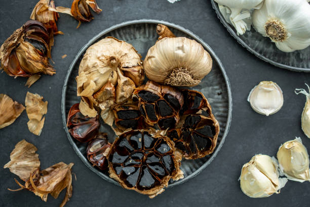 istock Garlic bulbs fresh, fermented, organic. 1327056740