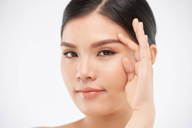 istock Attractive Smiling Woman Touching Face 1327060717