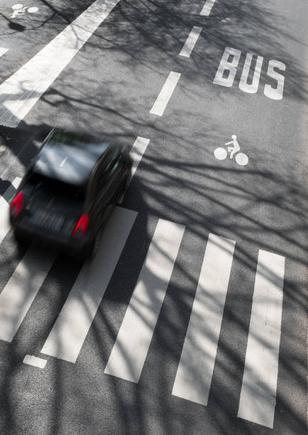 istock A bus lane and a car on the same road 1327060884