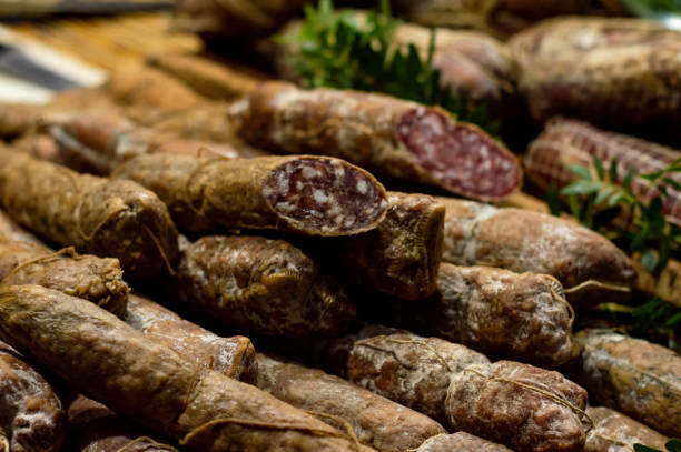 istock Italian salami and bacon, cured meat with bay leaf herbs 1327065143